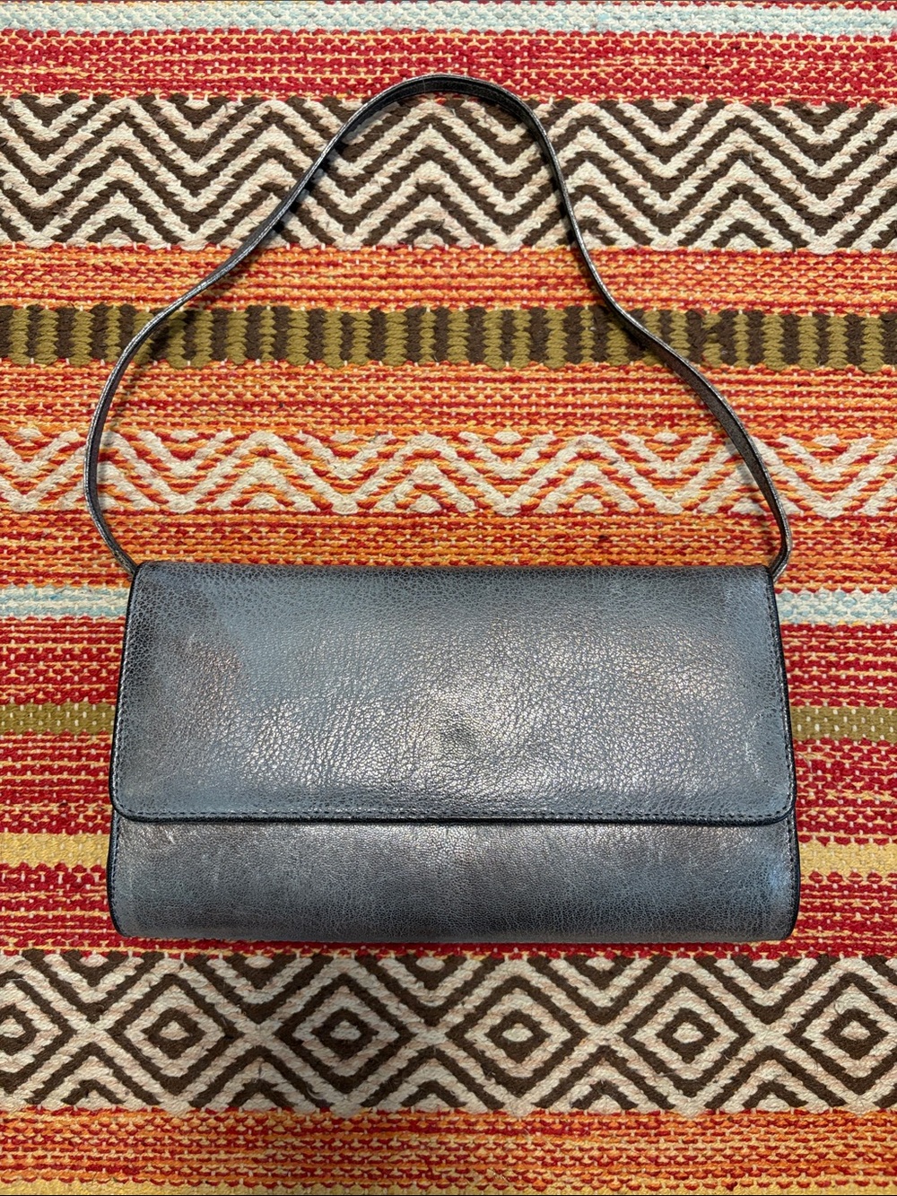 Rebeca Sanver minimalist metallic pewter-gray, silver leather clutch with strap